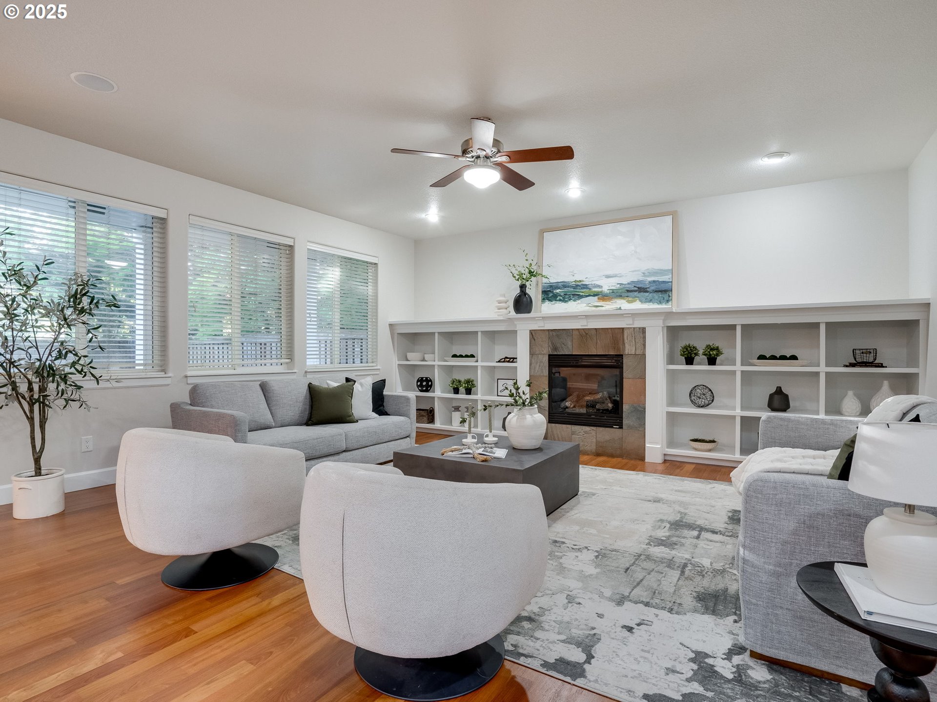 1308 Southeast 193rd Place Camas, WA 98607 - Photo 8 of 33 a living room with furniture a fireplace and a large window