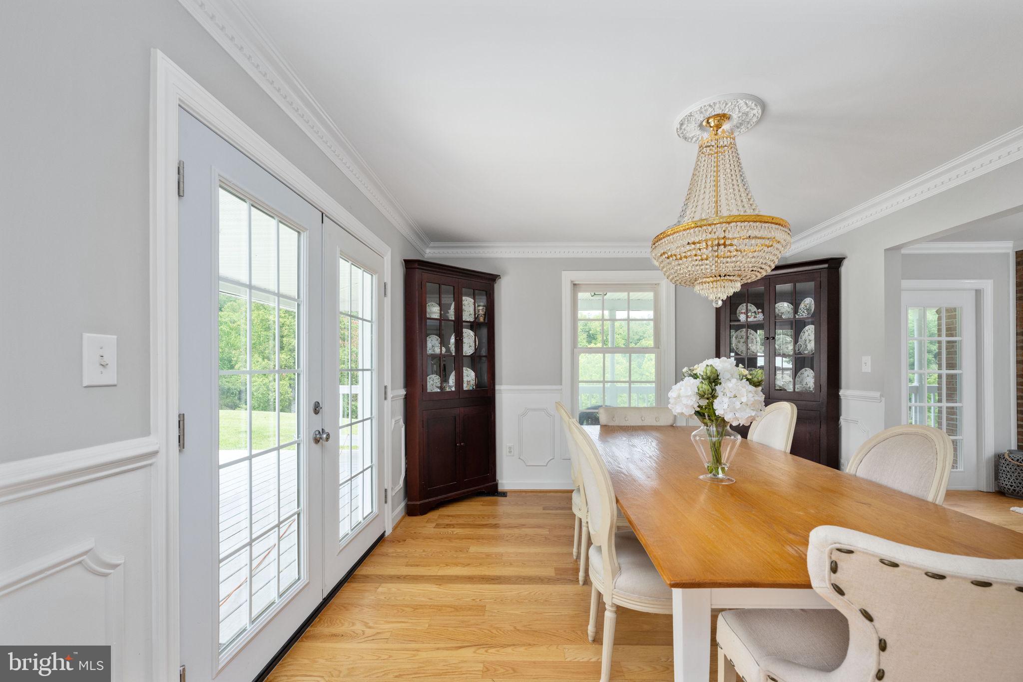 5191 Beach Ridge Lane Amissville, VA 20106 - Photo 20 of 91 a dining room with furniture a chandelier and wooden floor