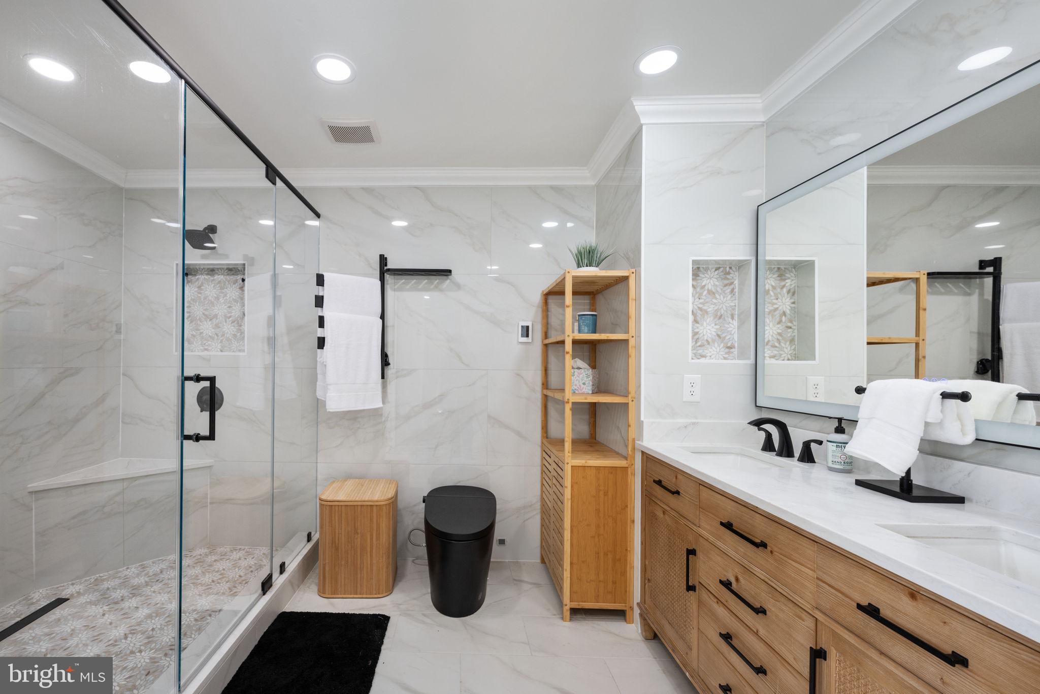 5191 Beach Ridge Lane Amissville, VA 20106 - Photo 27 of 91 a bathroom with a double vanity sink a toilet and shower