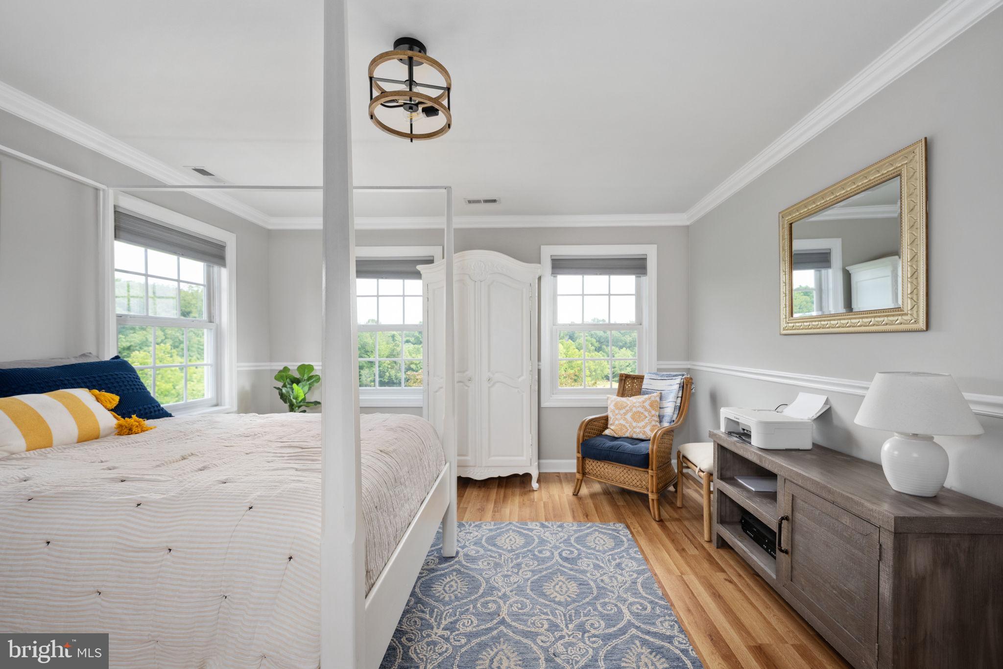 5191 Beach Ridge Lane Amissville, VA 20106 - Photo 32 of 91 a bedroom with furniture and a wooden floor
