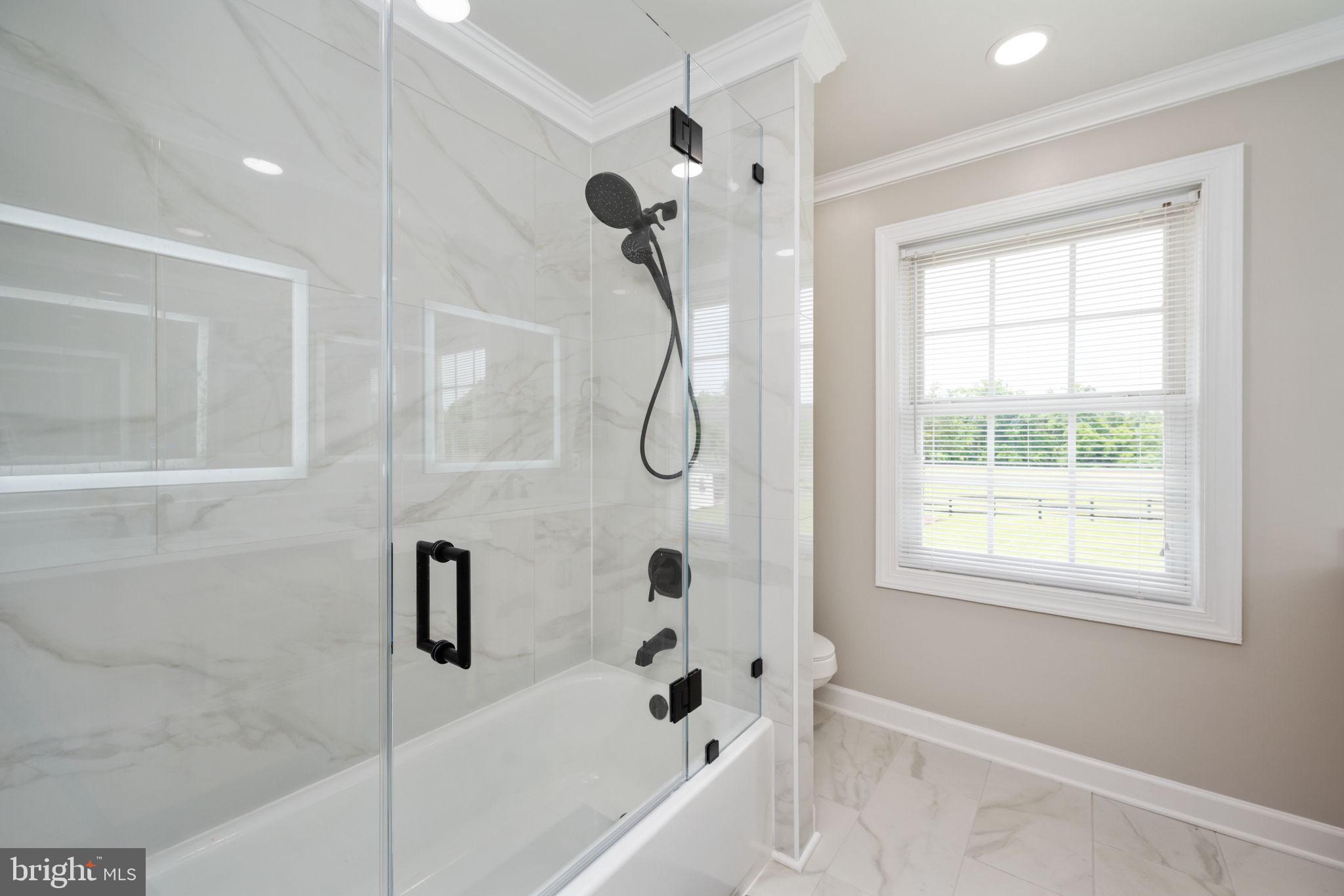 5191 Beach Ridge Lane Amissville, VA 20106 - Photo 34 of 91 a bathroom with a bath tub with a shower