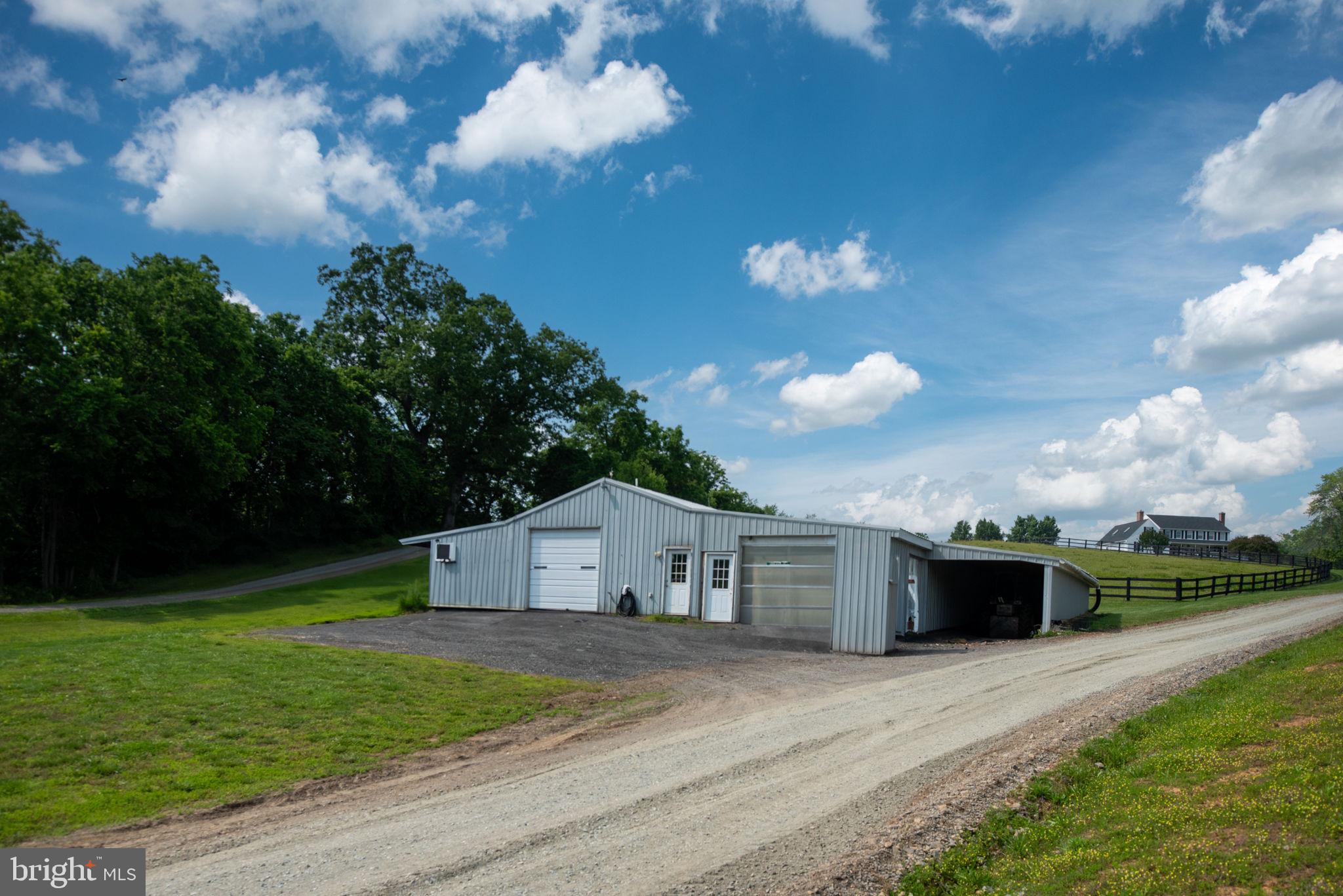 5191 Beach Ridge Lane Amissville, VA 20106 - Photo 48 of 91 a front view of a house with garden