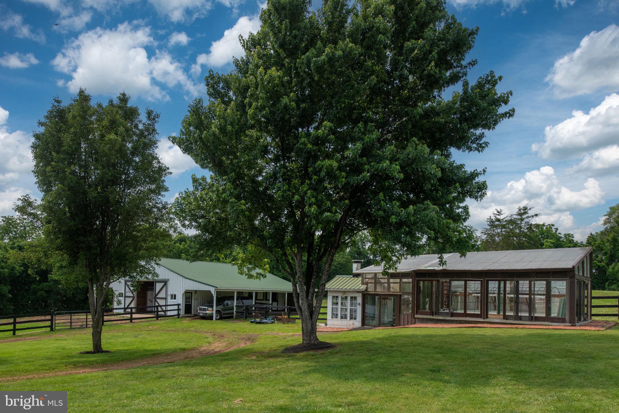 5191 Beach Ridge Lane Amissville, VA 20106 - Photo 52 of 91 a view of a house with a big yard and large trees