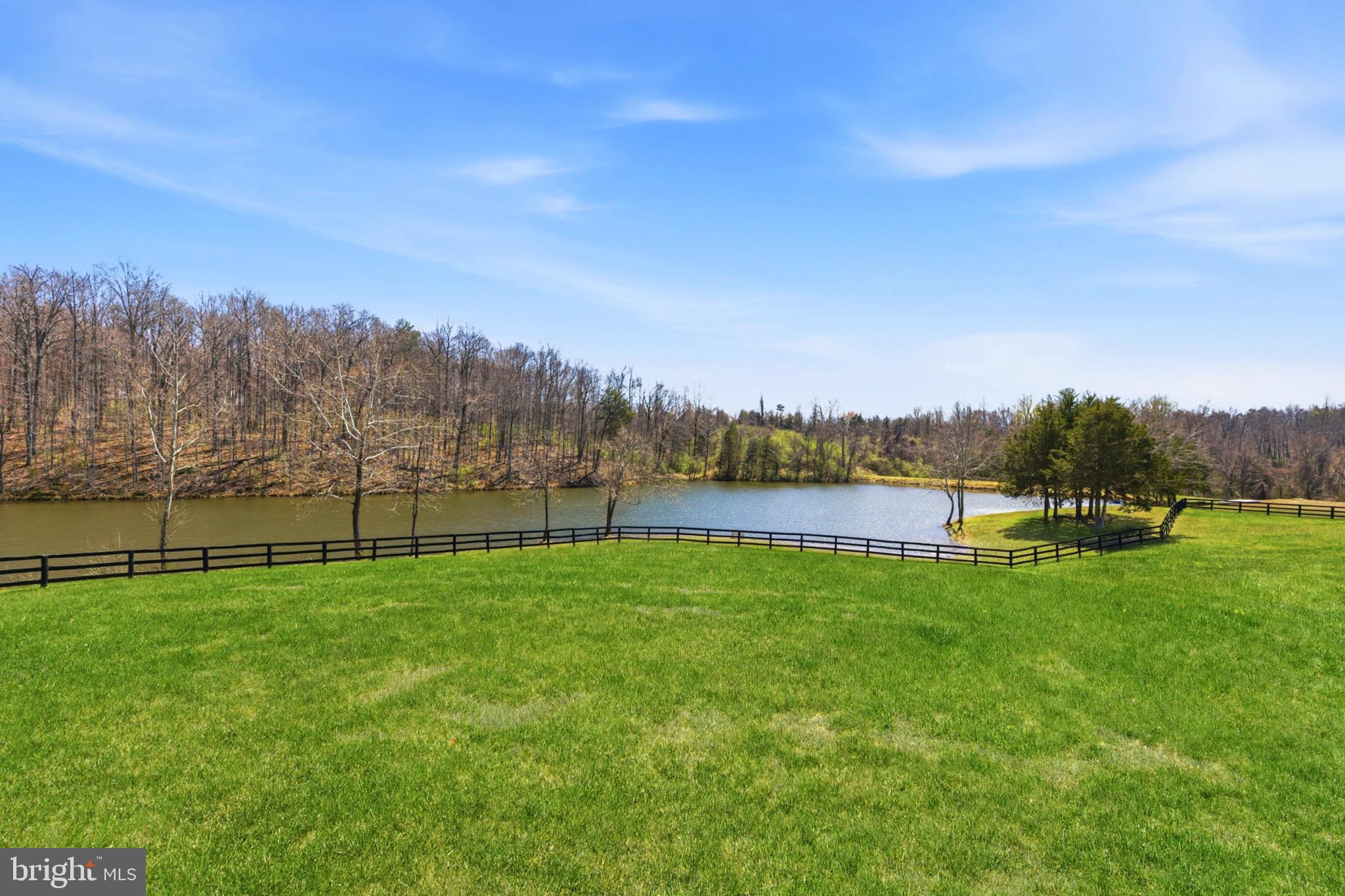 5191 Beach Ridge Lane Amissville, VA 20106 - Photo 58 of 91 a view of a lake with houses in the back