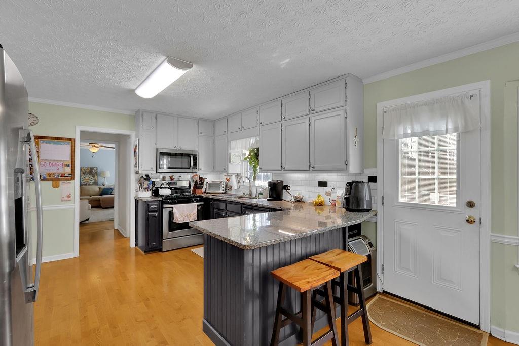 2385 Waterton Ridge Trail Grayson, GA 30017 - Photo 14 of 38 a kitchen with refrigerator and cabinets