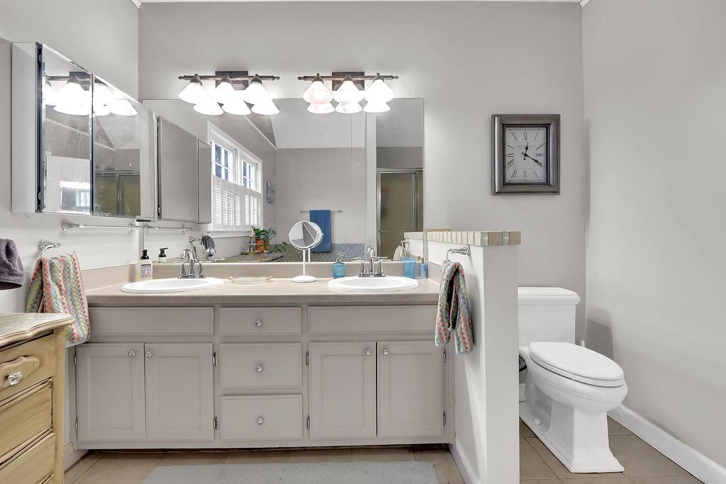 2385 Waterton Ridge Trail Grayson, GA 30017 - Photo 26 of 38 a bathroom with a toilet a sink and mirror