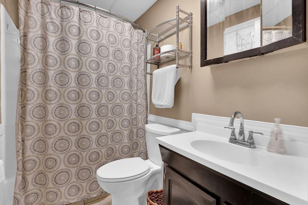 2385 Waterton Ridge Trail Grayson, GA 30017 - Photo 29 of 38 a bathroom with a sink a toilet and a mirror