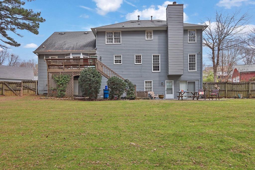2385 Waterton Ridge Trail Grayson, GA 30017 - Photo 35 of 38 a view of a house with a yard