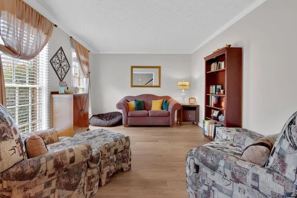 a bedroom with bed and window