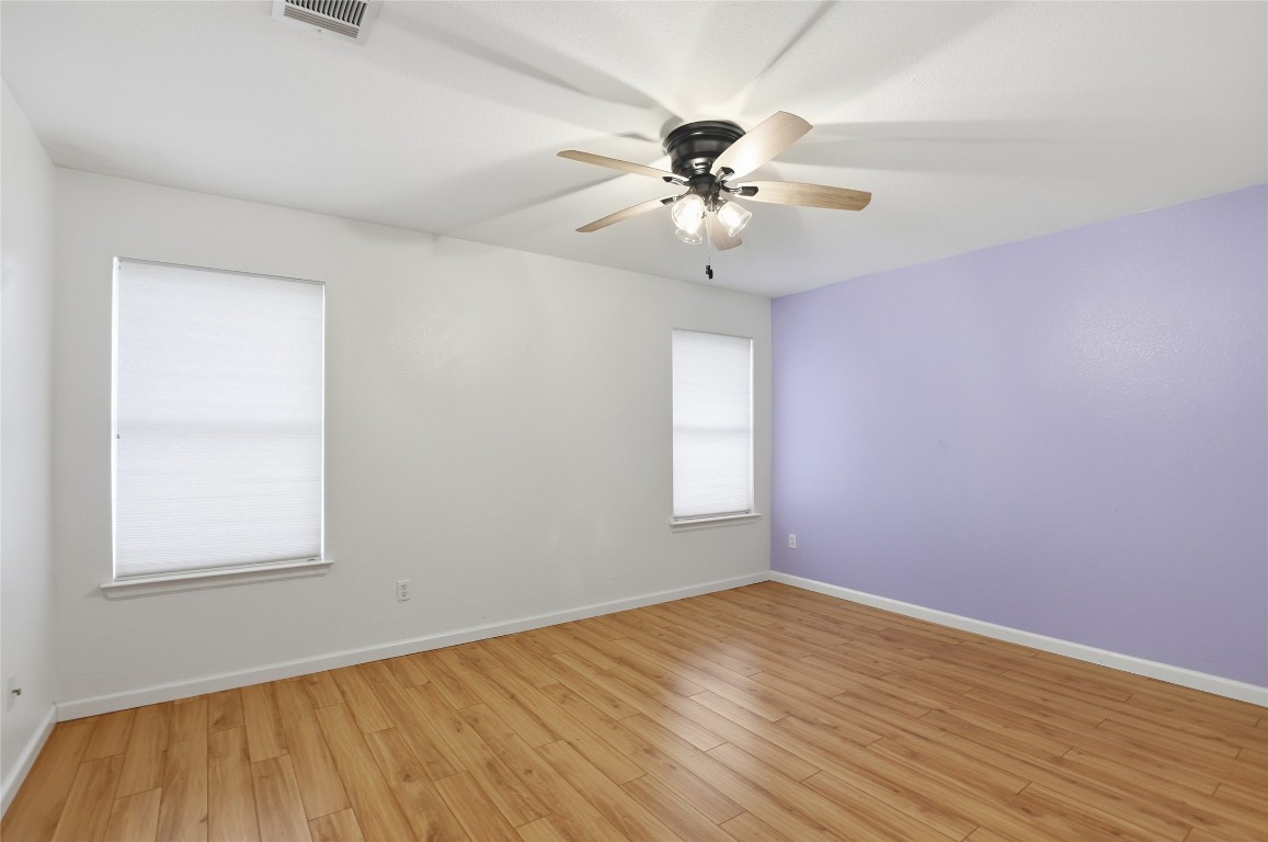 3215 Port Anne Way Leander, TX 78641 - Photo 15 of 30 wooden floor in an empty room with a window