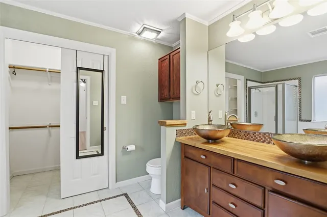 a spacious bathroom with a granite countertop sink and a mirror