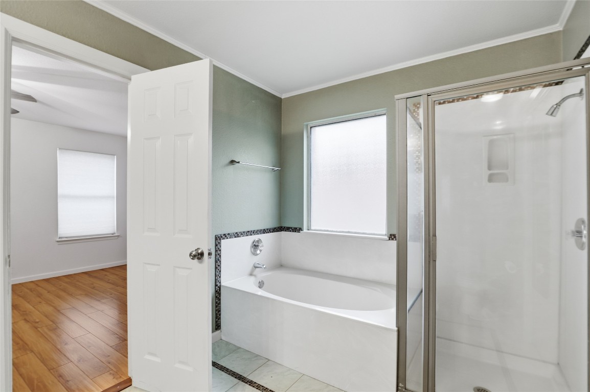3215 Port Anne Way Leander, TX 78641 - Photo 18 of 30 a white bath tub sitting in a bathroom