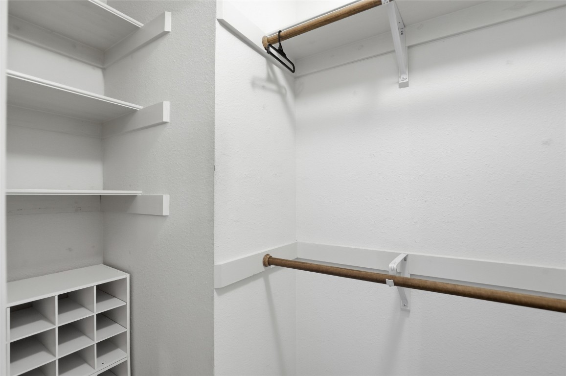 3215 Port Anne Way Leander, TX 78641 - Photo 19 of 30 a view of walk in closet with empty racks