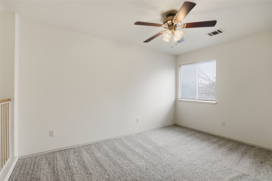 3215 Port Anne Way Leander, TX 78641 - Photo 23 of 30 an empty room with windows and fan