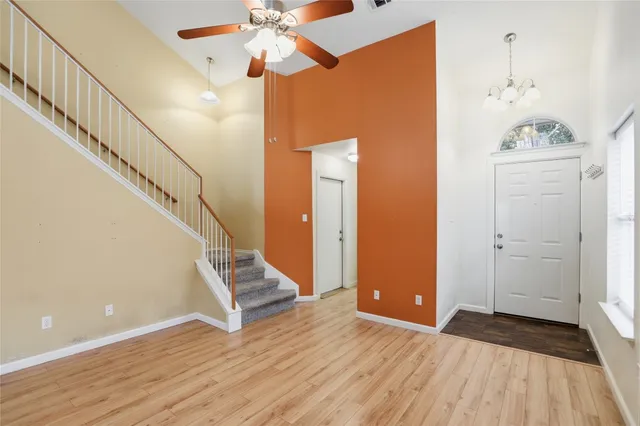a view of an entryway with wooden floor