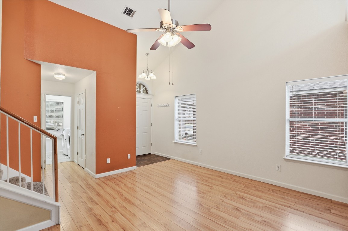 3215 Port Anne Way Leander, TX 78641 - Photo 5 of 30 a view of a livingroom with a ceiling fan and window