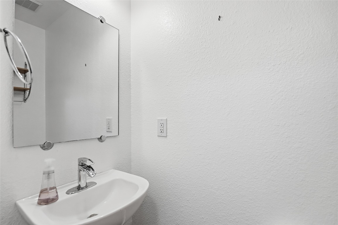3215 Port Anne Way Leander, TX 78641 - Photo 7 of 30 a bathroom with a sink and mirror
