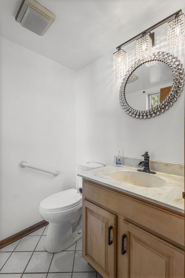 21220 Silktree Circle Plainfield, IL 60544 - Photo 21 of 29 a bathroom with a sink and a mirror