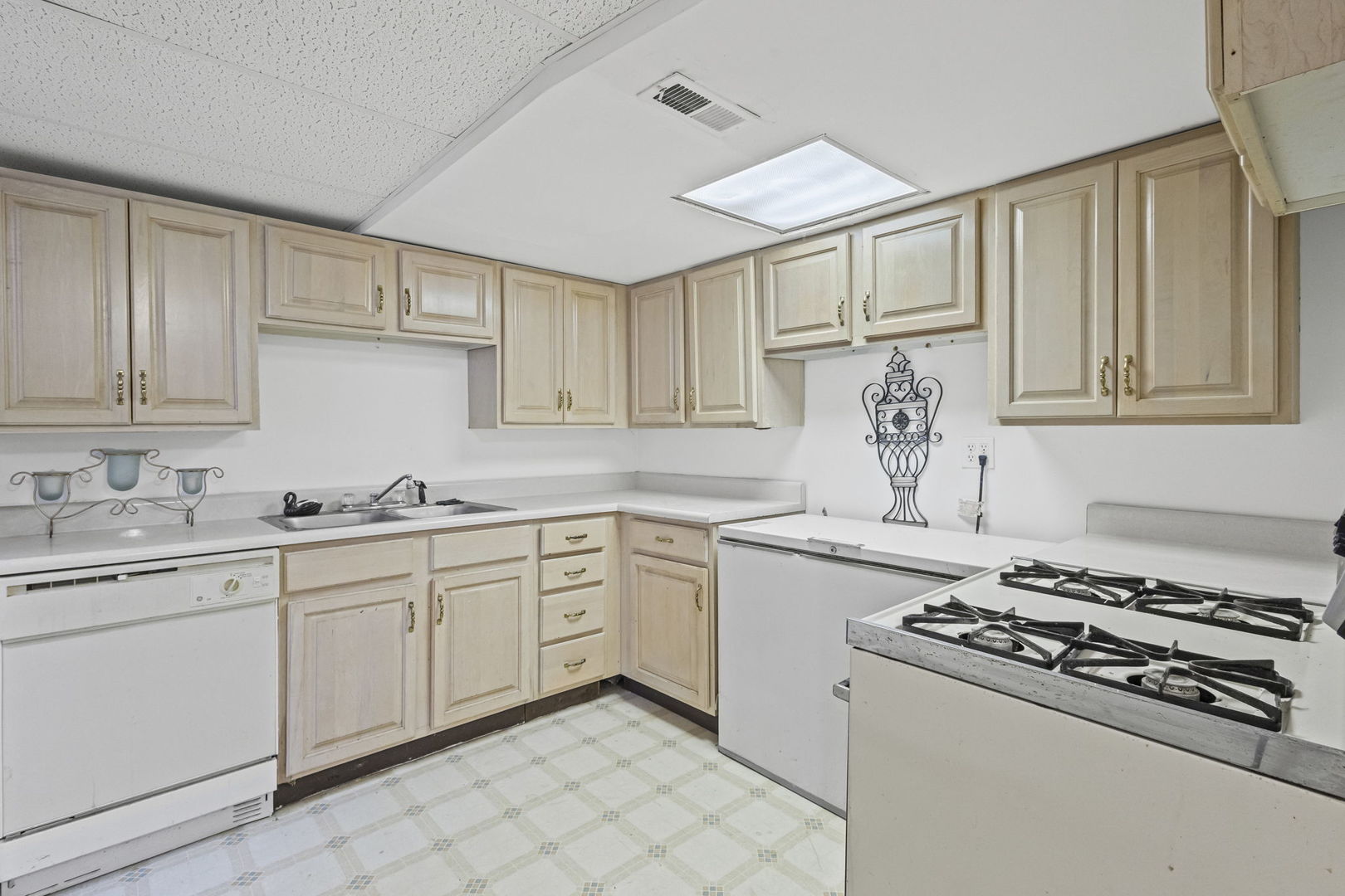 21220 Silktree Circle Plainfield, IL 60544 - Photo 22 of 29 a kitchen with white cabinets sink and stove