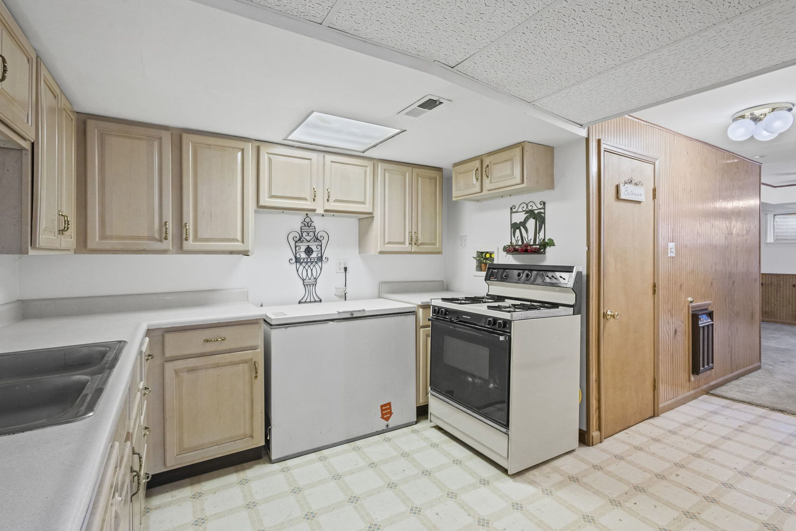 21220 Silktree Circle Plainfield, IL 60544 - Photo 23 of 29 a kitchen with white cabinets and white appliances