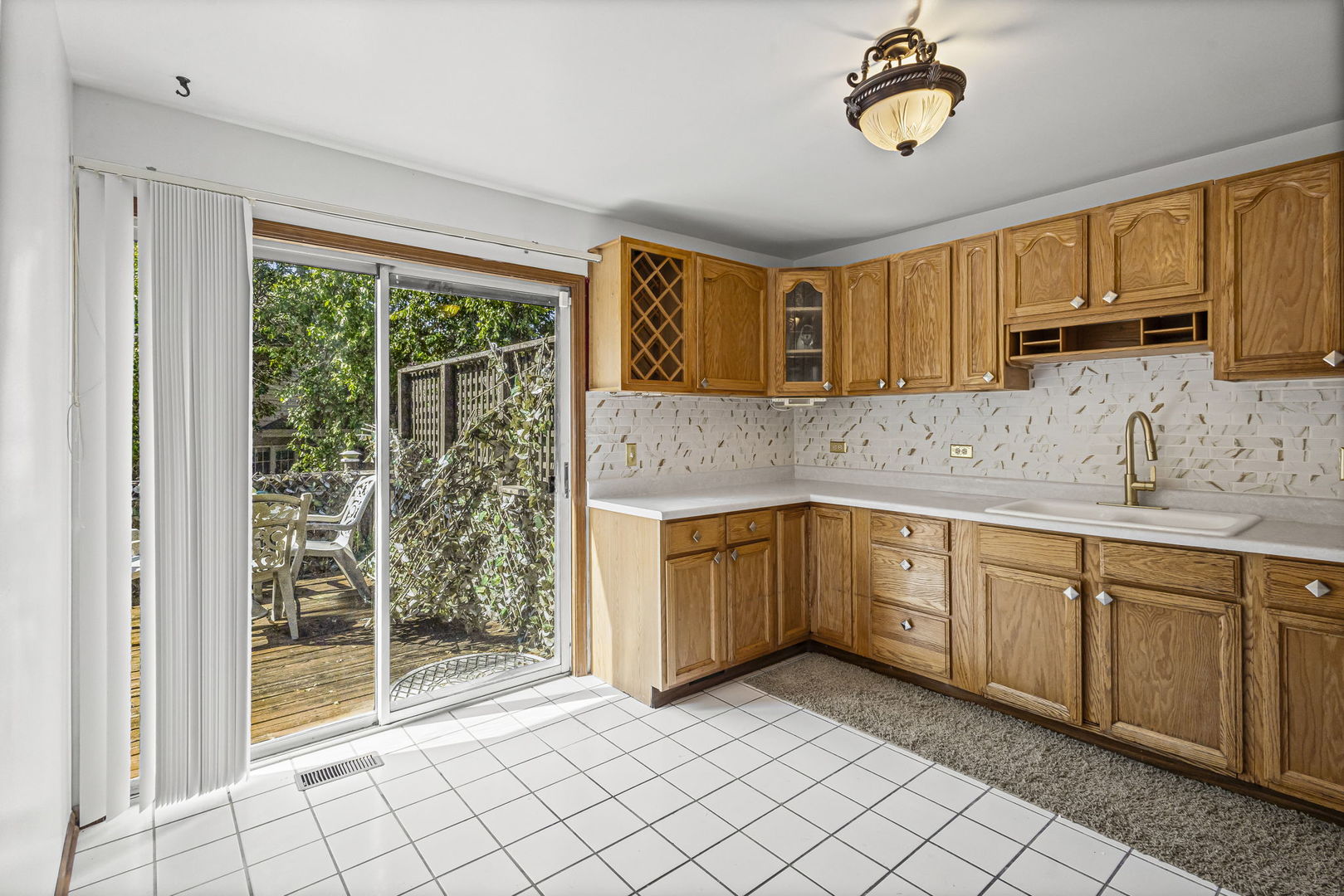 21220 Silktree Circle Plainfield, IL 60544 - Photo 8 of 29 a kitchen with a sink cabinets and window