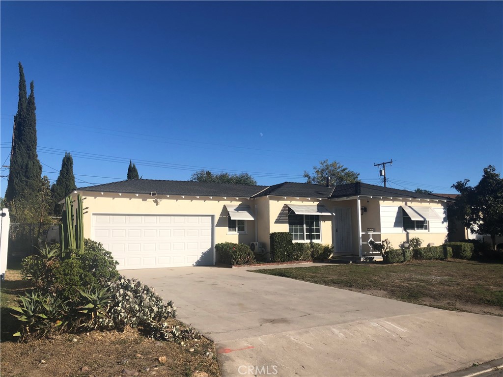 224 North Bircher Street Anaheim, CA 92801 - Photo 2 of 10 a view of a white house with a yard