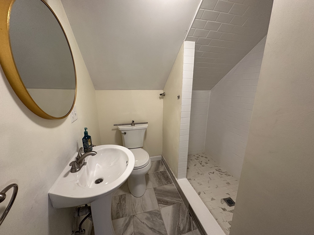 8 Pike Street Hopkinton, MA 01748 - Photo 28 of 34 a bathroom with a sink and a mirror
