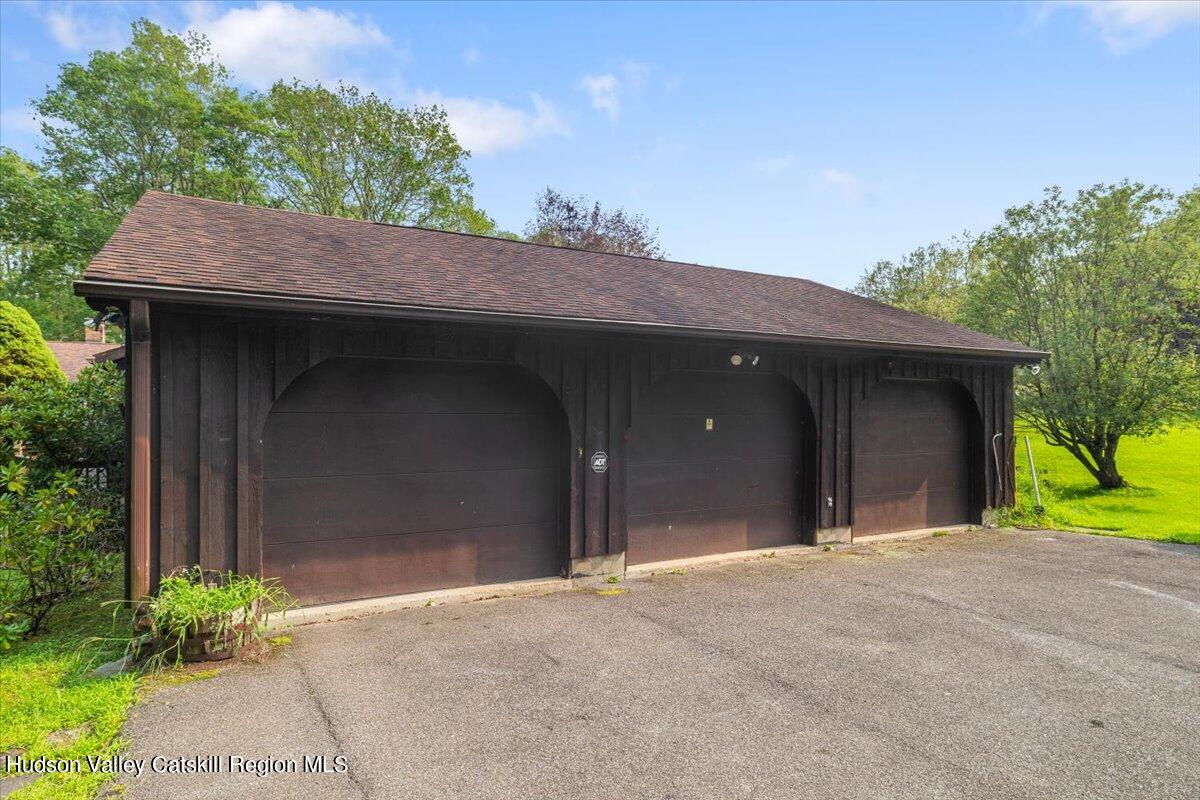 119 Mt Laurel Road Kerhonkson, NY 12446 - Photo 27 of 29 a view of a house with a yard and garage