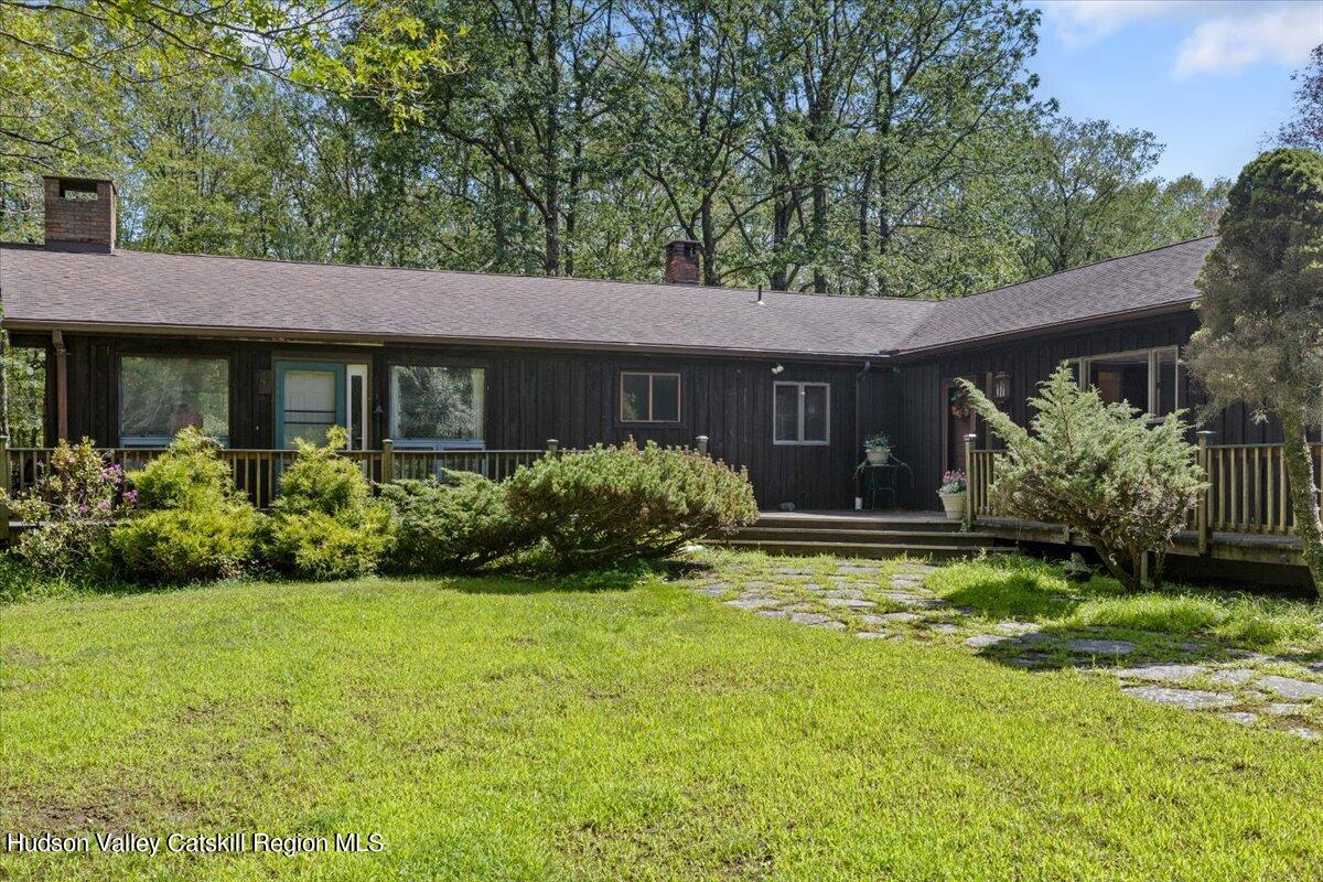 119 Mt Laurel Road Kerhonkson, NY 12446 - Photo 4 of 29 a view of a house with garden and a sitting area
