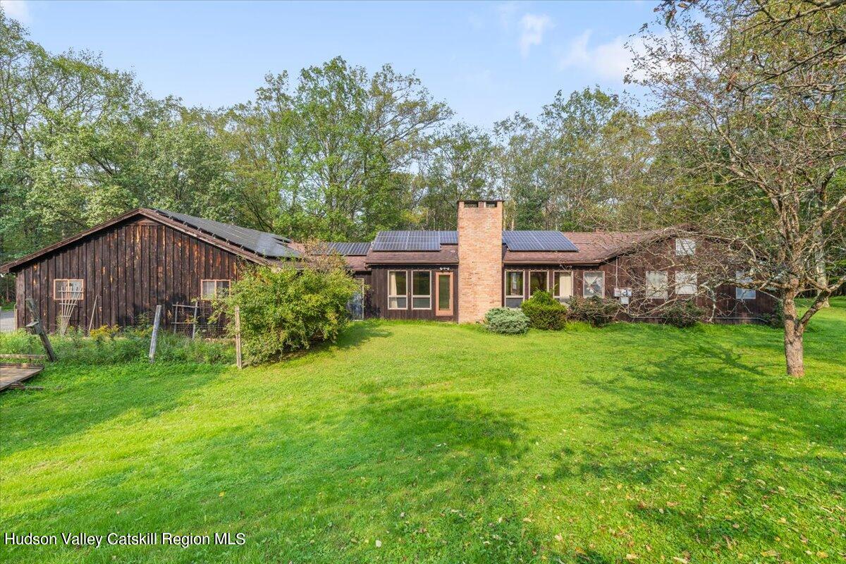 119 Mt Laurel Road Kerhonkson, NY 12446 - Photo 9 of 29 a view of a house with backyard and garden