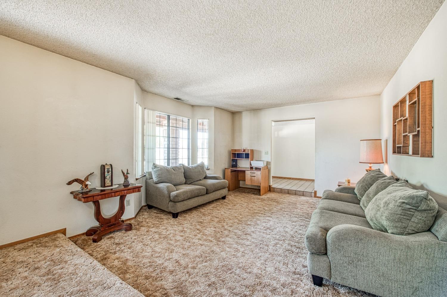 35516 John Albert Drive Madera, CA 93636 - Photo 12 of 60 a living room with furniture and window