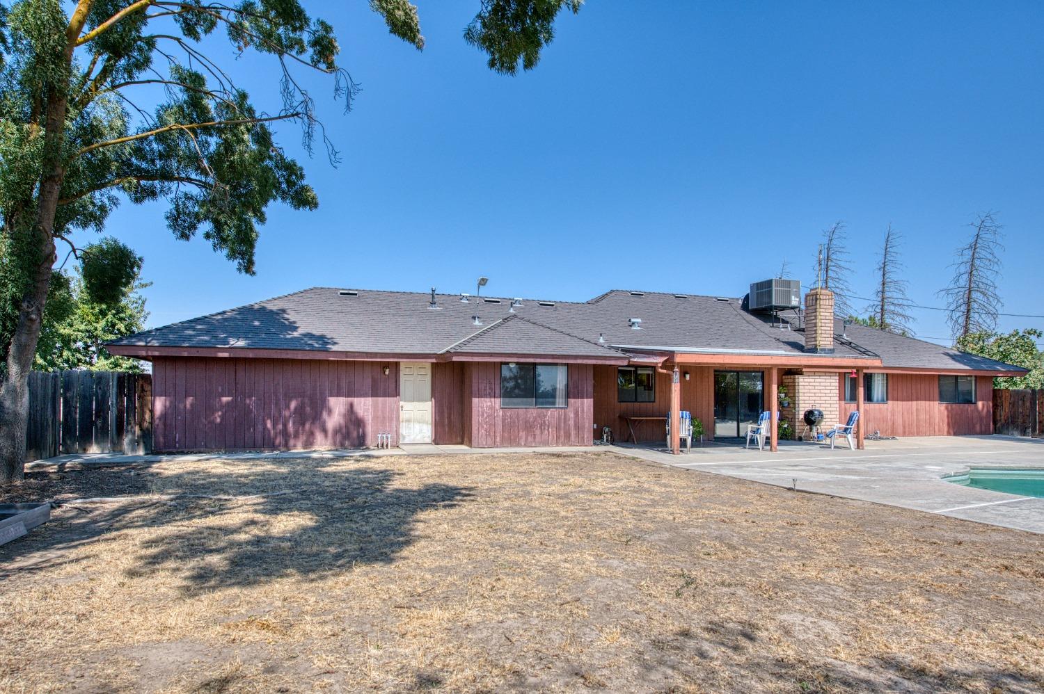 35516 John Albert Drive Madera, CA 93636 - Photo 35 of 60 a front view of a house with a yard