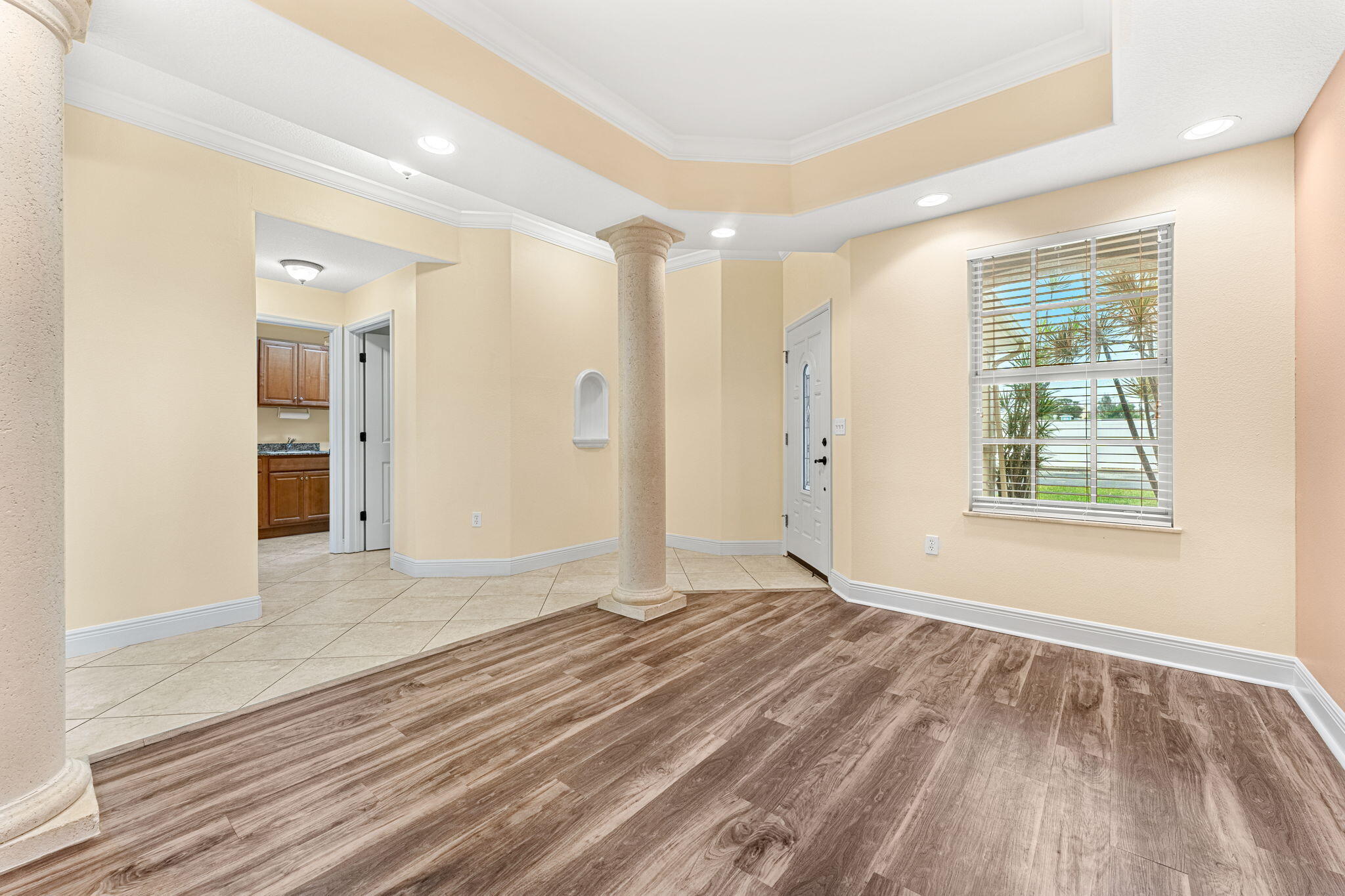 204 Holman Road, Unit 3 Cape Canaveral, FL 32920 - Photo 11 of 61 wooden floor in an empty room with a window