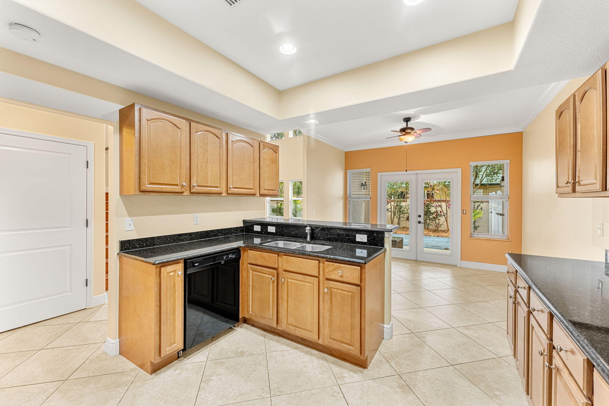 204 Holman Road, Unit 3 Cape Canaveral, FL 32920 - Photo 19 of 61 a kitchen with stainless steel appliances granite countertop a stove a sink and a microwave