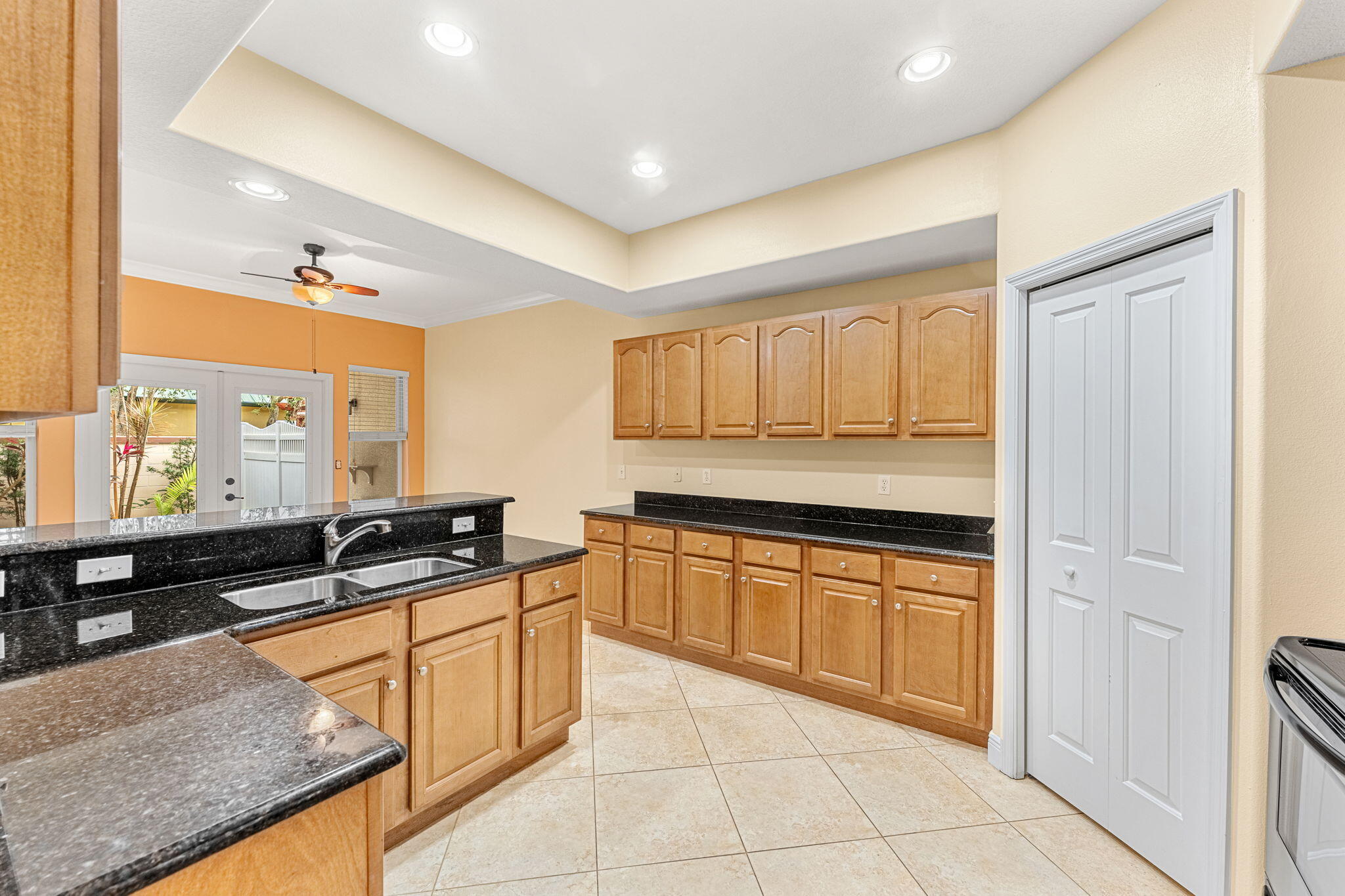 204 Holman Road, Unit 3 Cape Canaveral, FL 32920 - Photo 21 of 61 a kitchen with stainless steel appliances granite countertop a sink and cabinets