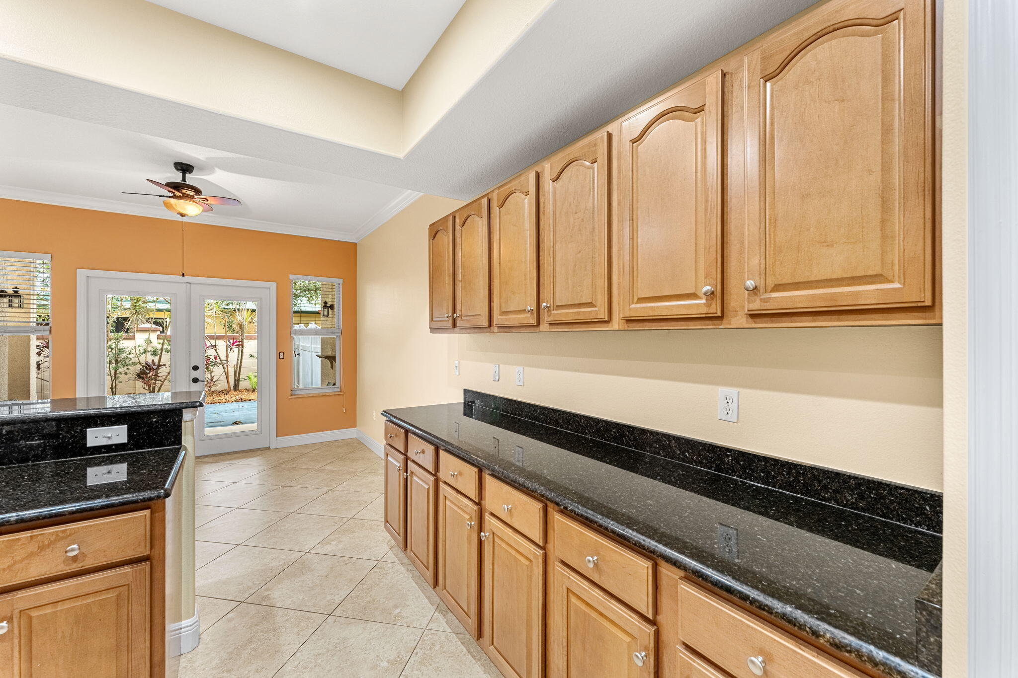 204 Holman Road, Unit 3 Cape Canaveral, FL 32920 - Photo 22 of 61 a kitchen with stainless steel appliances a sink dishwasher and cabinets next to a window