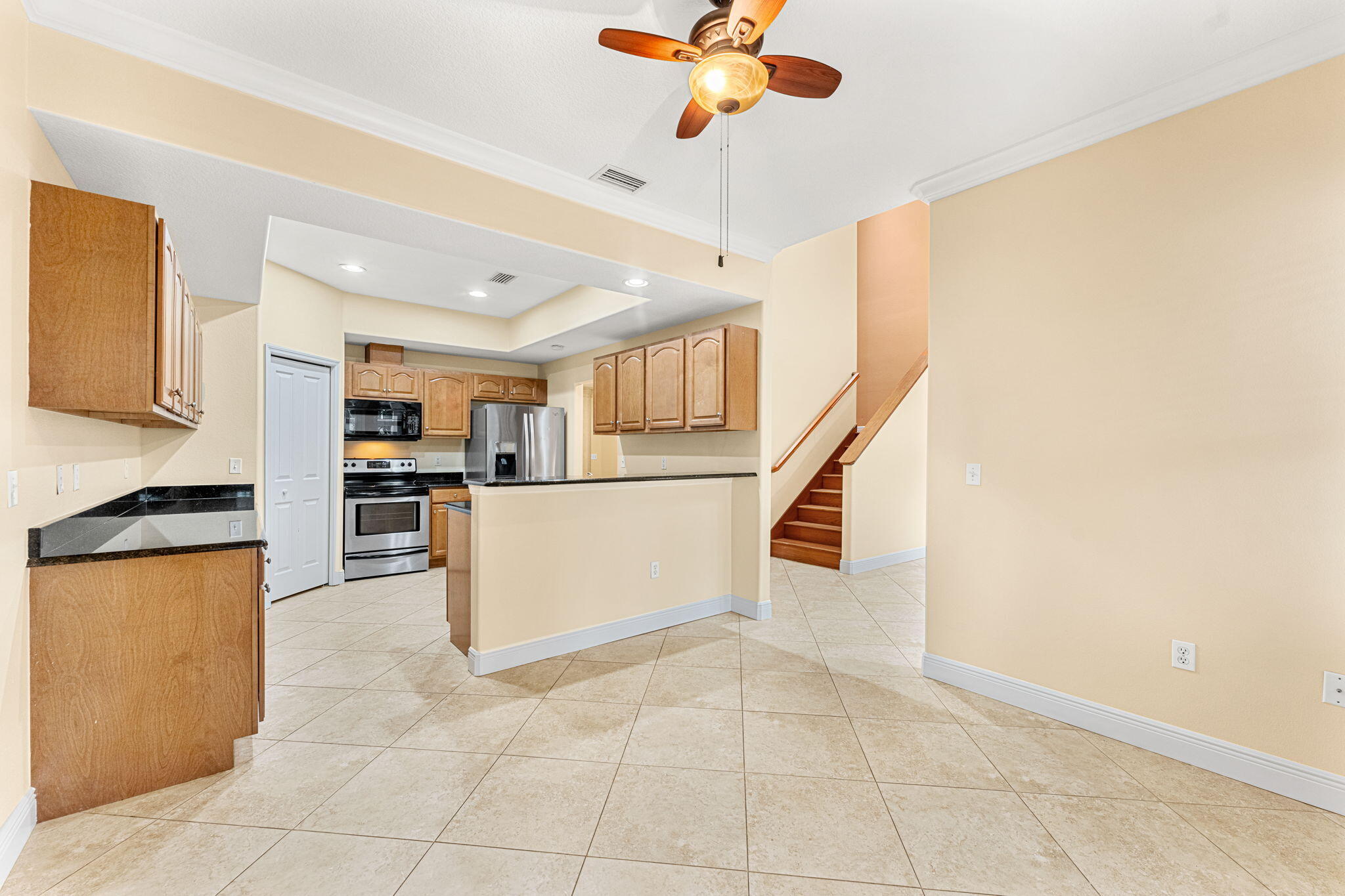 204 Holman Road, Unit 3 Cape Canaveral, FL 32920 - Photo 23 of 61 a view of kitchen with microwave and cabinets