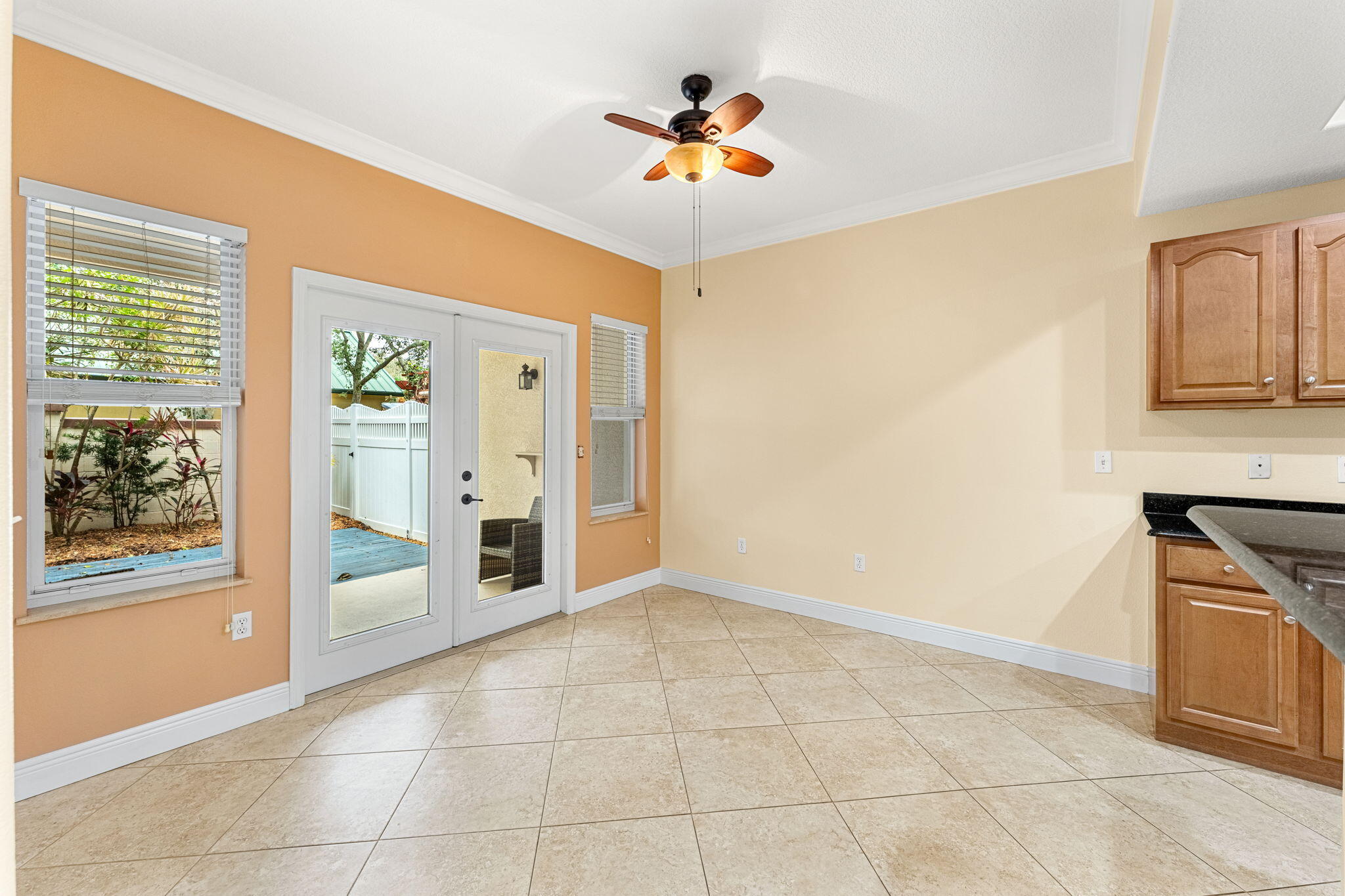 204 Holman Road, Unit 3 Cape Canaveral, FL 32920 - Photo 24 of 61 a view of an empty room with cabinet and a fireplace
