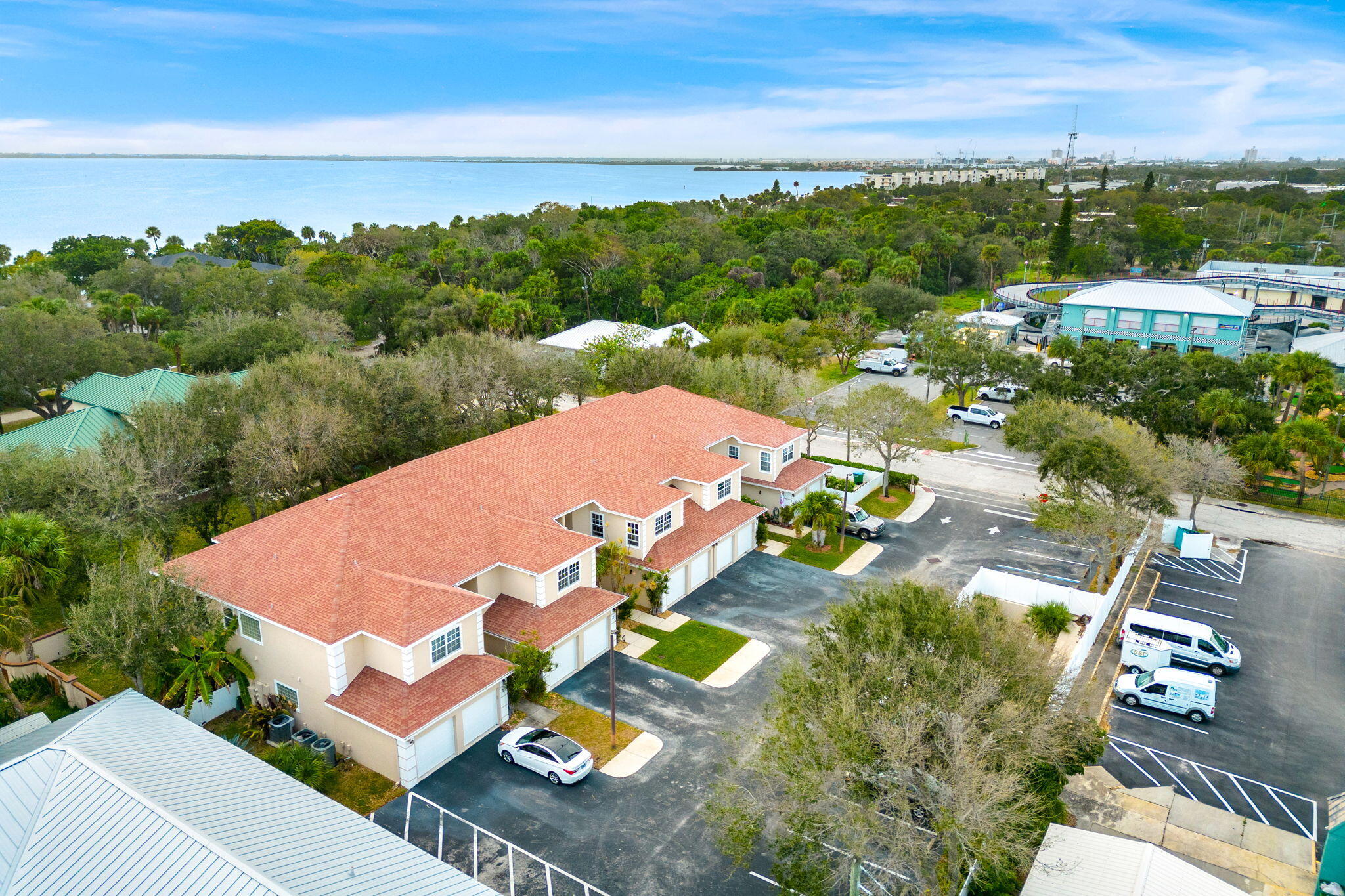 204 Holman Road, Unit 3 Cape Canaveral, FL 32920 - Photo 31 of 61 an aerial view of residential houses with outdoor space and street view