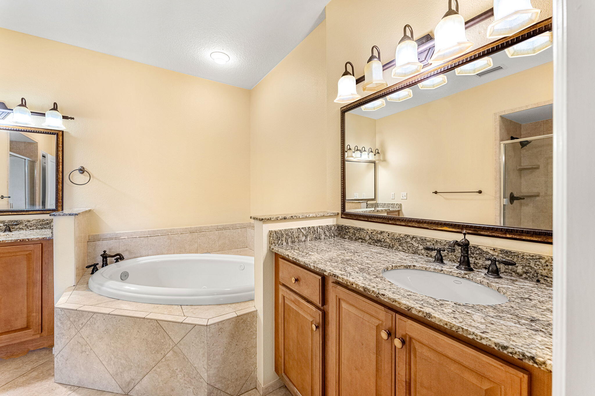 204 Holman Road, Unit 3 Cape Canaveral, FL 32920 - Photo 38 of 61 a bathroom with a granite countertop sink and a mirror