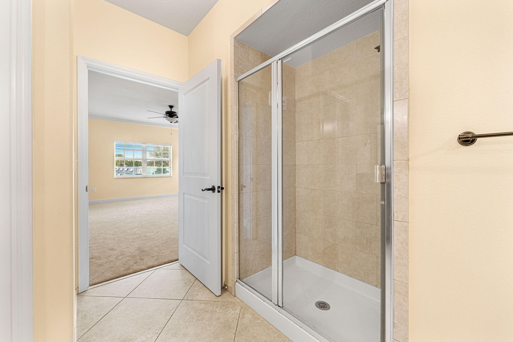 204 Holman Road, Unit 3 Cape Canaveral, FL 32920 - Photo 39 of 61 a bathroom with a glass shower door