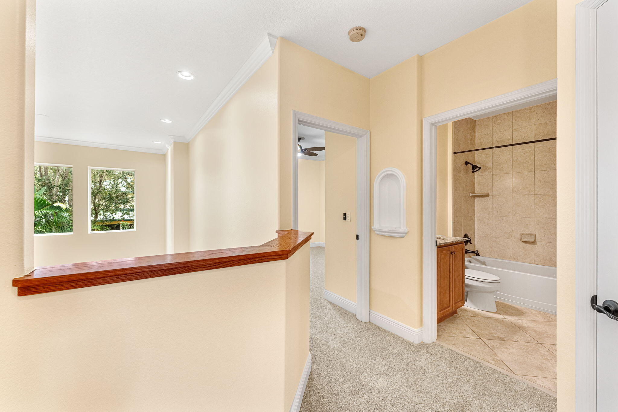 204 Holman Road, Unit 3 Cape Canaveral, FL 32920 - Photo 40 of 61 a view of a bathroom with a shower and a tub
