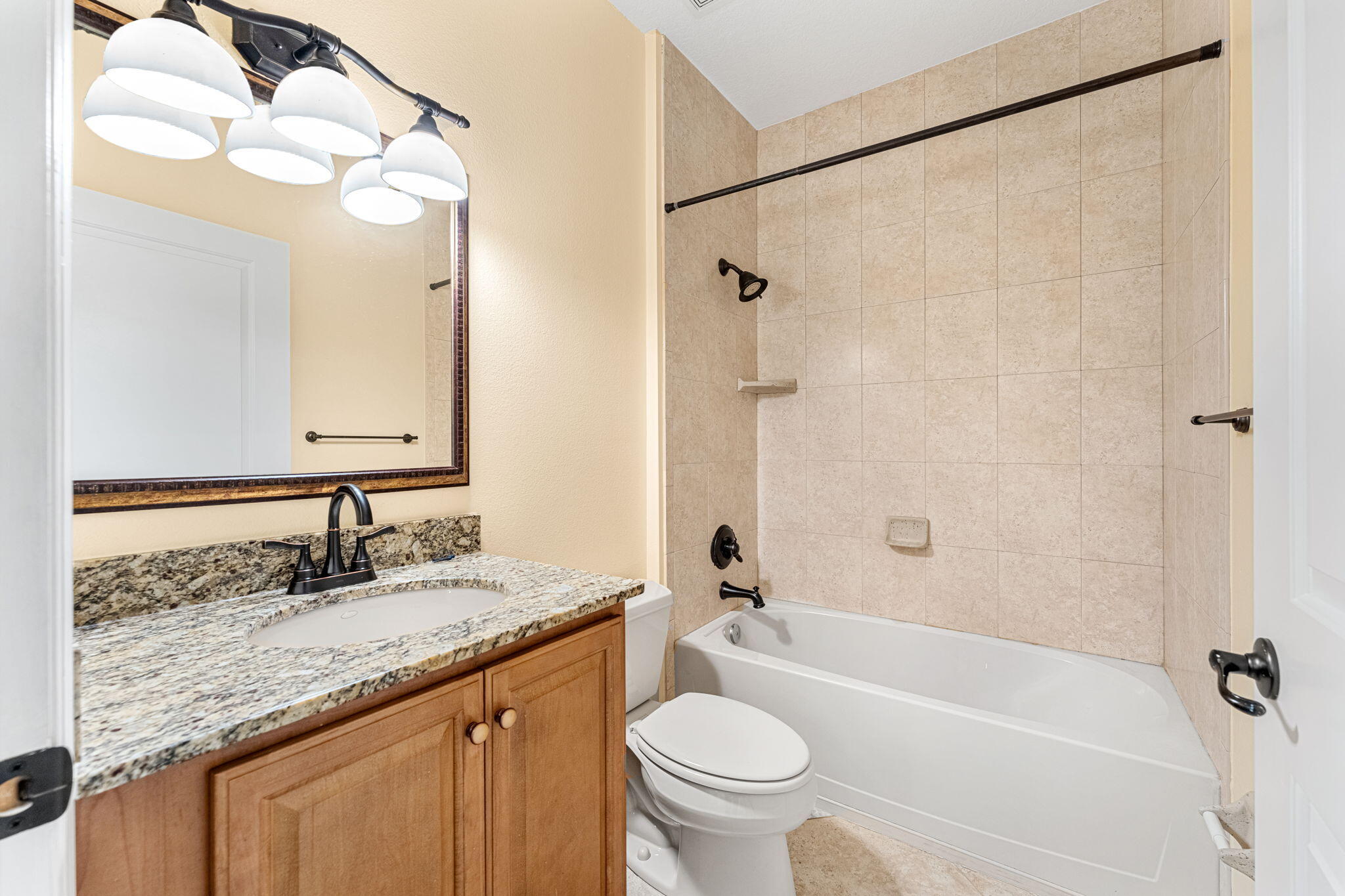 204 Holman Road, Unit 3 Cape Canaveral, FL 32920 - Photo 41 of 61 a bathroom with a granite countertop sink a toilet and shower
