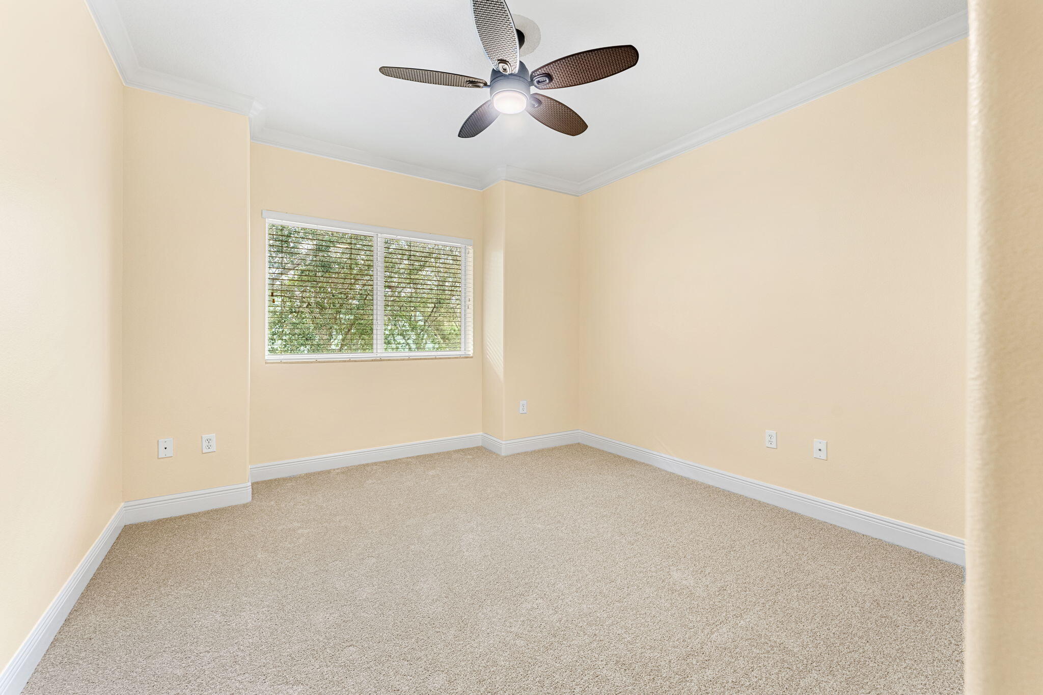 204 Holman Road, Unit 3 Cape Canaveral, FL 32920 - Photo 42 of 61 an empty room with windows and fan