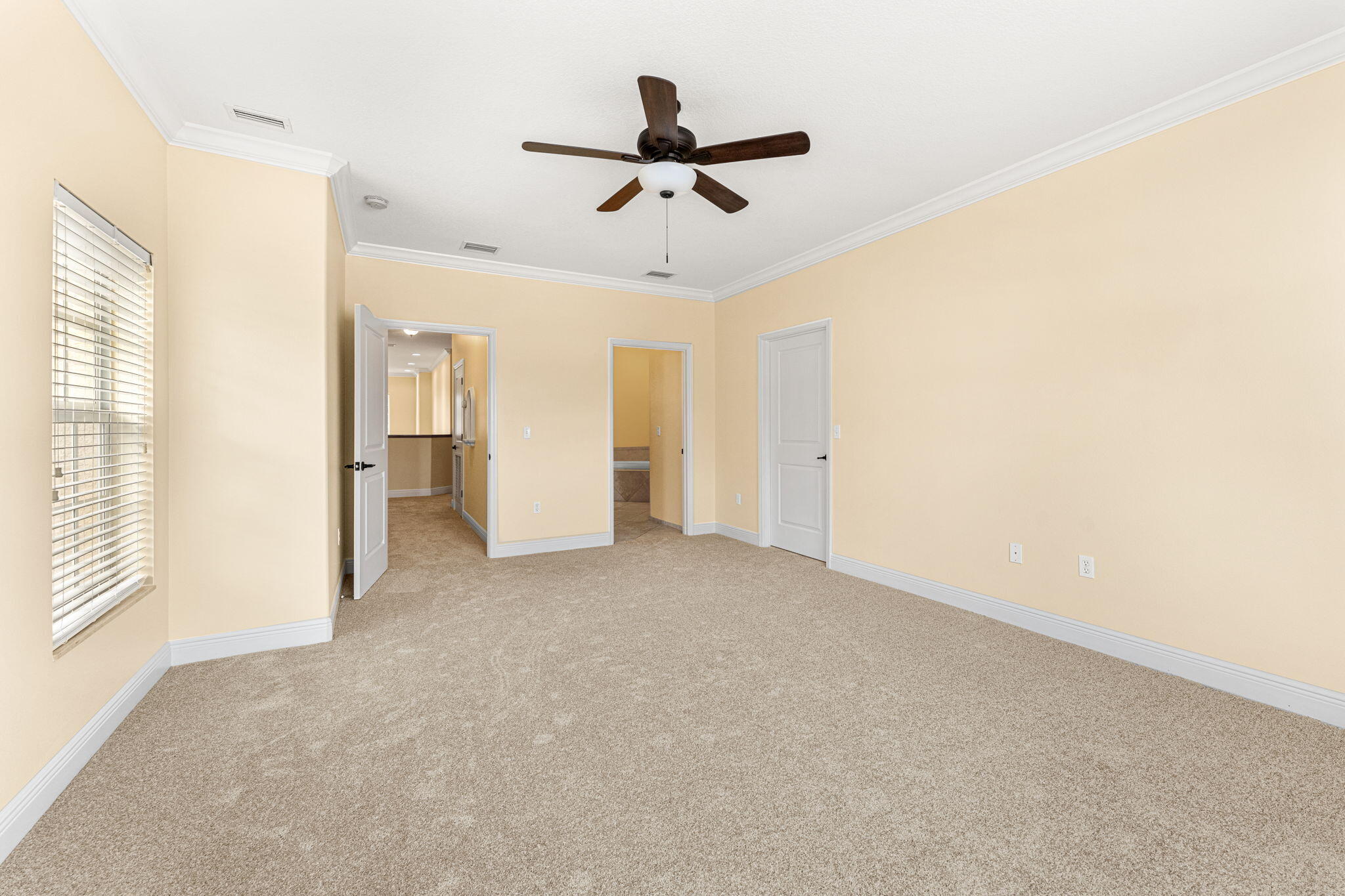 204 Holman Road, Unit 3 Cape Canaveral, FL 32920 - Photo 48 of 61 a view of a livingroom with a ceiling fan and window