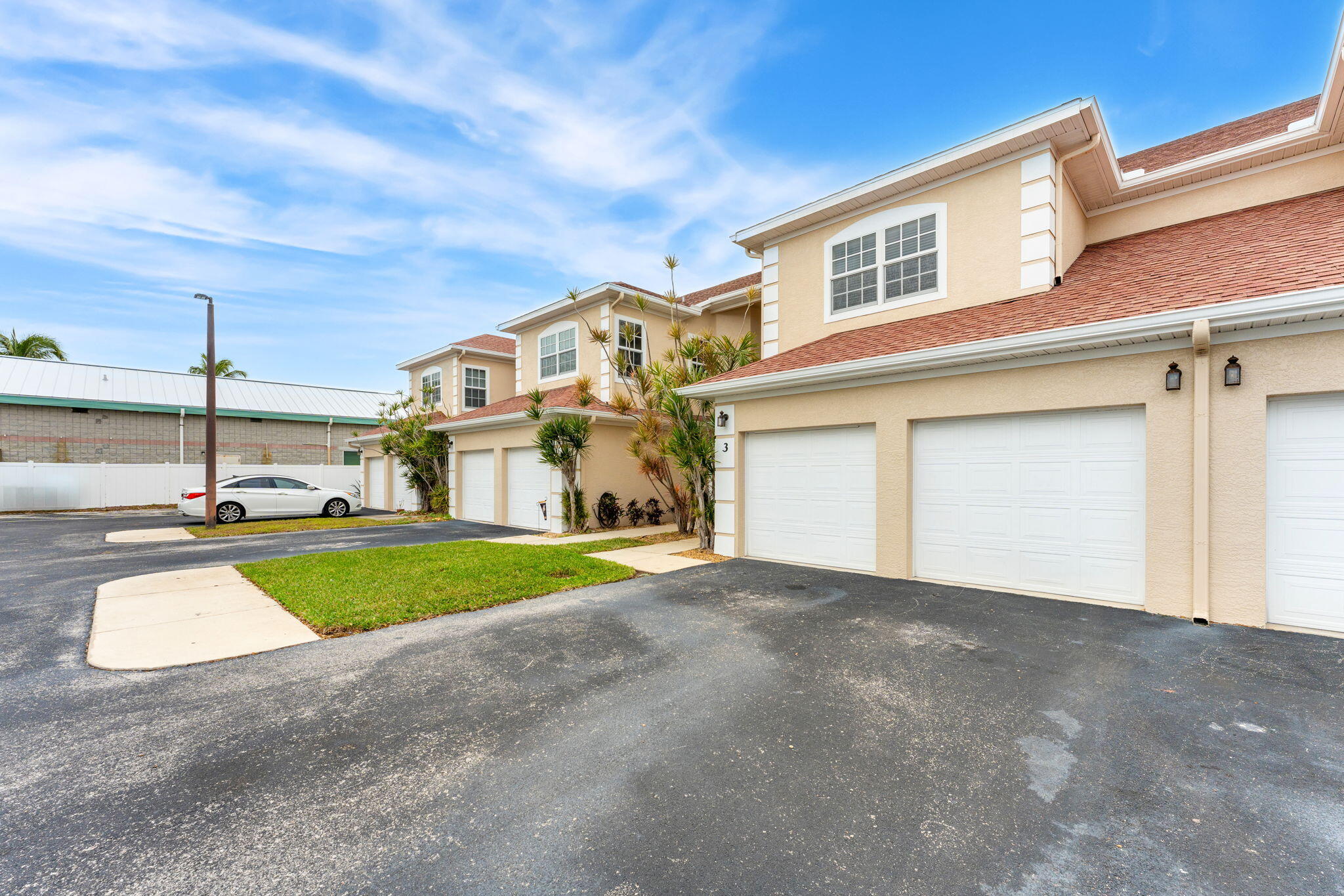 204 Holman Road, Unit 3 Cape Canaveral, FL 32920 - Photo 5 of 61 a view of a house with a yard and a street