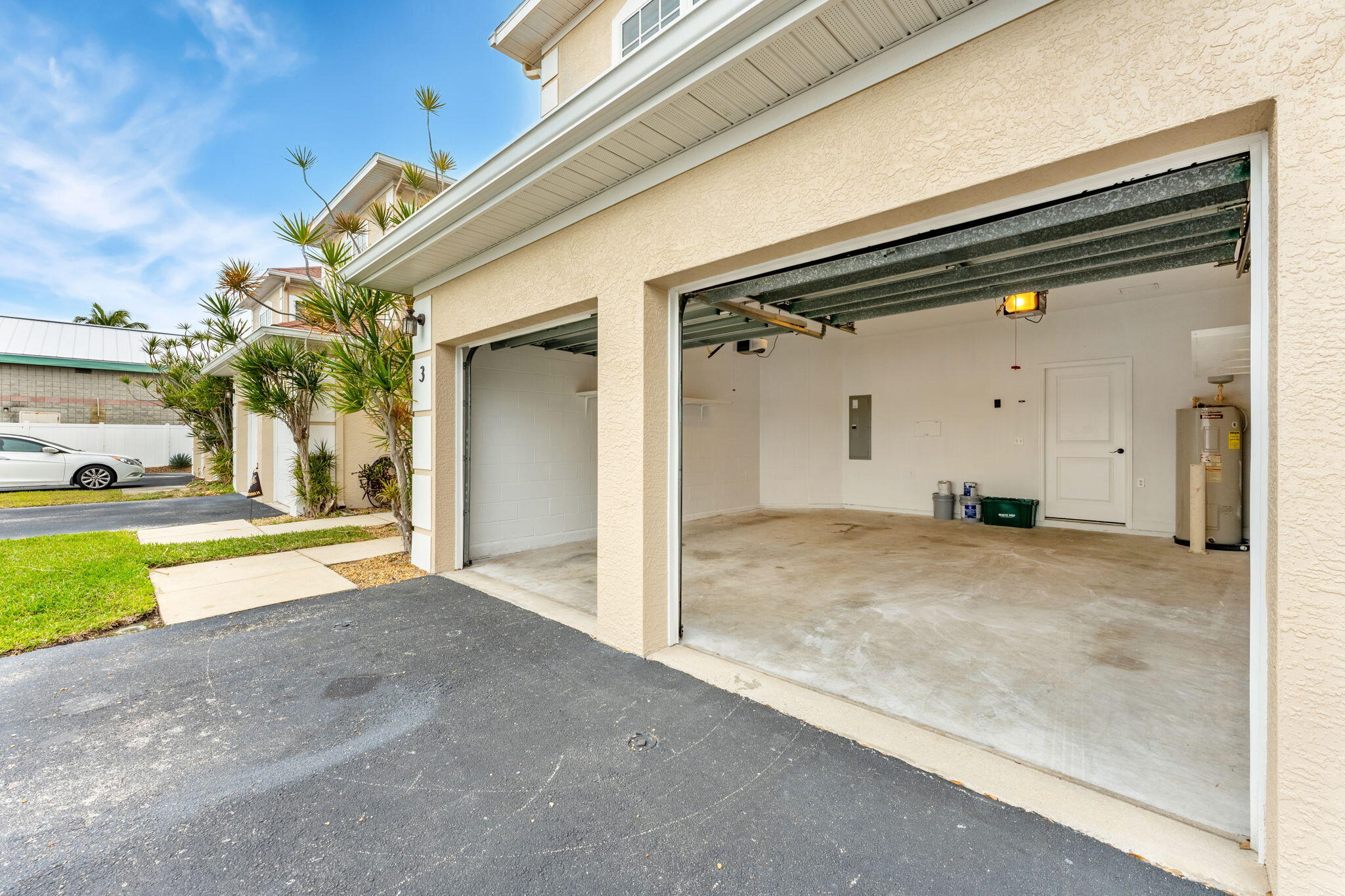 204 Holman Road, Unit 3 Cape Canaveral, FL 32920 - Photo 59 of 61 a view of a porch with a table and chairs and floor to ceiling window