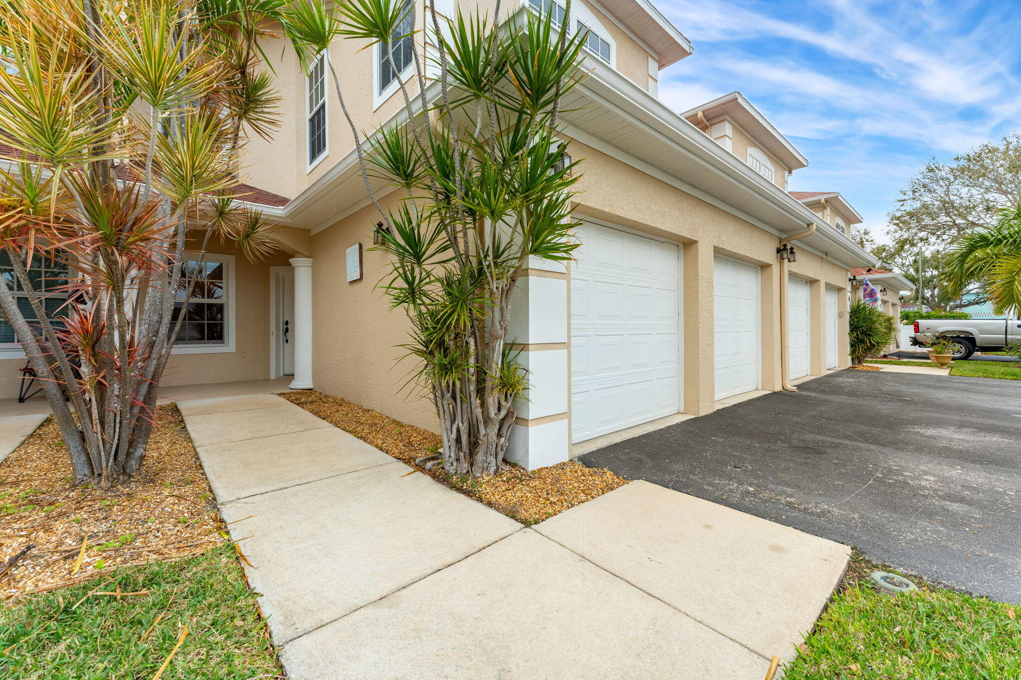 204 Holman Road, Unit 3 Cape Canaveral, FL 32920 - Photo 60 of 61 a front view of a house with a yard
