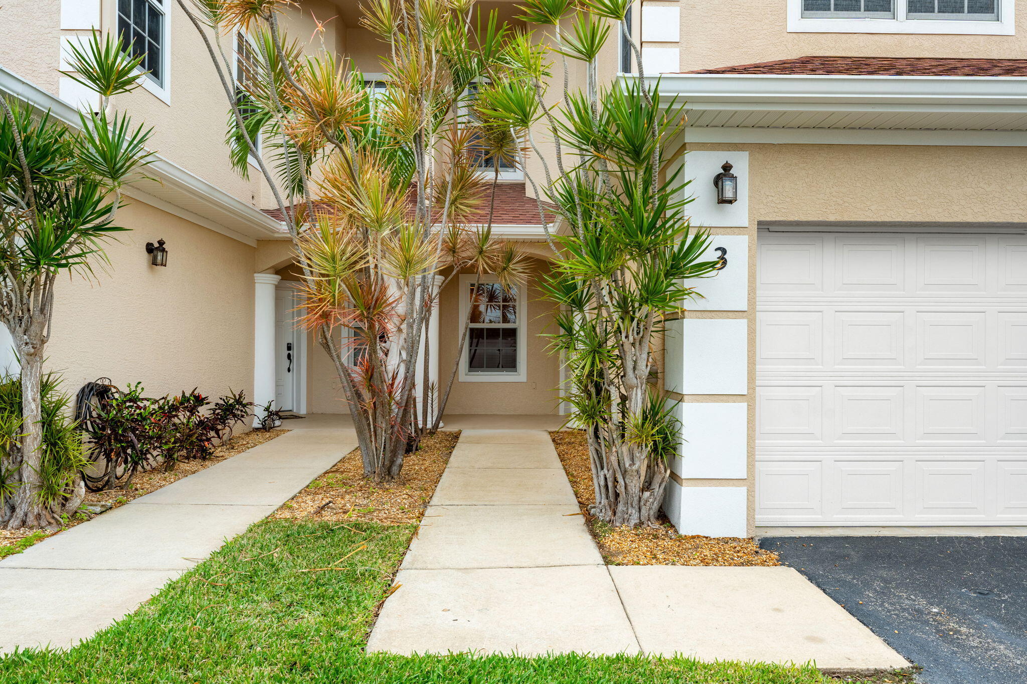 204 Holman Road, Unit 3 Cape Canaveral, FL 32920 - Photo 6 of 61 a front view of house with yard