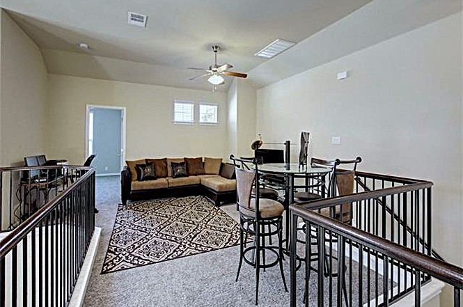 14001 Avery Ranch Boulevard, Unit 801 Austin, TX 78717 - Photo 14 of 26 A well-lit loft area provides flexible living with ample space for relaxation and entertaining.
